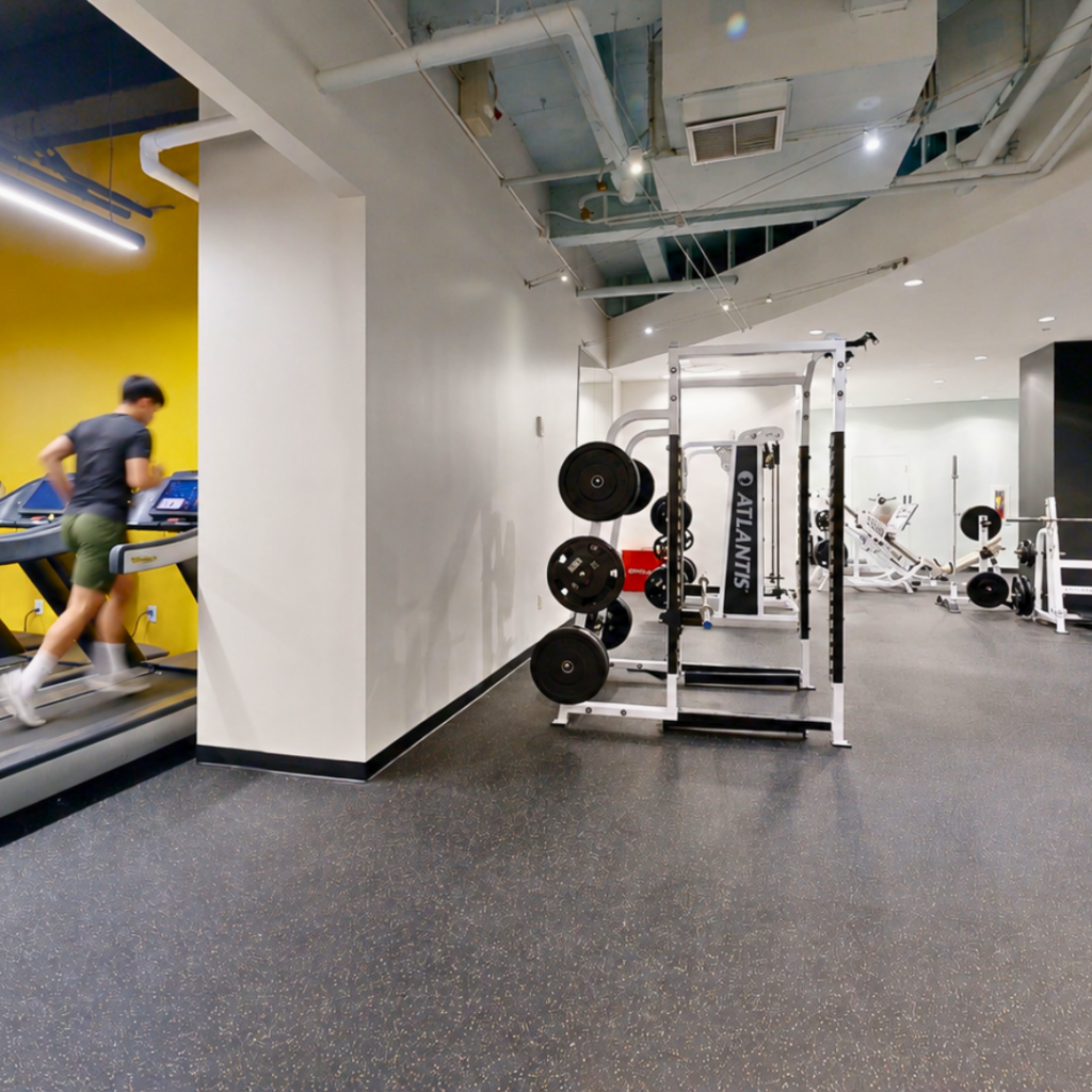 Market West Fitness Member running on the treadmill